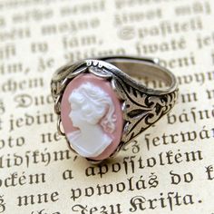 Oxidized sterling silver plated ring which is adjustable and has oak leaf details on the sides. In the center is a 14x10mm pink and white girl cameo. Vampire History, Cameo Rings, Swan Aesthetic, History Professor, Cameo Jewelry, Wire Ring, Cameo Ring, Pink Lady, Bella Swan