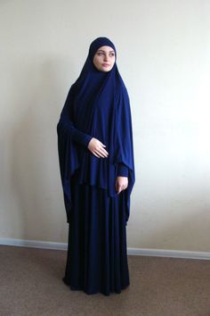 The original model of the traditional hijab - khimar, which is a single movement can become a niqab. You just need to lift hijab from his chin and closes face. affordable blue color is so convenient, it looks noble and strict, elegant and stylish. This model burkas have a cuff that will make your hijab is not only very beautiful but also convenient for daily use. This handy headdress like those who do not yet know how to wind a scarf, busy mums and female students. It is simple and concise, suit Modest Blue Niqab For Eid, Blue Modest Khimar For Eid, Modest Solid Color Niqab, Blue Long Sleeve Modest Khimar, Khimar Niqab, Muslim Dress Abaya, Long Hijab, Muslim Dresses, Dress Abaya