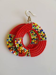 This listing is for ALL 11 pairs like shown above. The earrings are 100% handmade using original fine beads. Colorful and bright colors. ^^These earrings ships through dhl express. More earrings; https://www.etsy.com/shop/TribalTess?ref=seller-platform-mcnav&section_id=21293980 Buy multiple items and pay shipping for ONE item ONLY. Vibrant Beaded Earrings As A Gift, Vibrant Beaded Earrings For Gifts, Traditional Multicolor Earrings With Polished Beads, Traditional Multicolor Earrings With Large Beads, Traditional Colorful Round Bead Earrings, Traditional Round Beaded Earrings With Large Beads, Traditional Multicolor Beaded Earrings, Handmade Multicolor Traditional Hoop Earrings, Handmade Traditional Multicolor Hoop Earrings