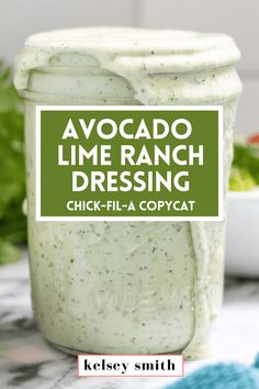 avocado lime ranch dressing in a mason jar with the title above it that reads, avocado lime ranch dressing chicken - fila copycat