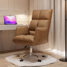 a brown leather office chair sitting in front of a desk with a laptop on it