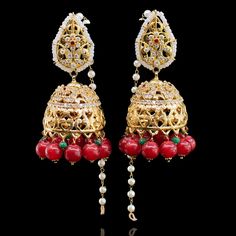 A must-have classic piece to complement your festivities! The look includes necklace, a pair of earrings and a nose ring. This divine set features CZ stones in combination with dangling ruby beads paired with matching earrings and a stunning nose ring designed with kundan stones and pearl moti. Gold-plated on high-quality brass as base metal. Made by order. Kindly allow 5-7 weeks for the delivery of this item. For custom or urgent requests, please contact support@alacouture.com. *Please Note: We Nose Ring Designs, Heritage Jewellery, Ruby Beads, Waist Chain, Head Accessories, Gift Card Shop, Cz Stone, Base Metal, Men's Collection