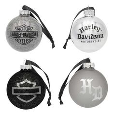 four ornaments with black and white designs are shown in three different styles, each featuring the harley davidson logo on one ornament