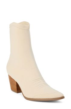 A pointy toe, Cuban heel and curvy topline reflect the Western-influenced design of this ankle boot made with a stretchy knit upper. 2 1/2" heel; 1/2" platform 8" shaft Pull-on style Textile upper/synthetic lining and sole Imported Cream Pointed Toe Fitted Boots, Fitted Cream Boots With Pointed Toe, Fitted Cream Pointed Toe Boots, Fitted Cream Heeled Boots For Winter, Spring Fitted Cream Heeled Boots, Cream High Heeled Boots, Fitted Cream High Heel Boots, Fitted Cream Heeled Boots For Spring, Cream Colored Fitted Heeled Boots With Pointed Toe