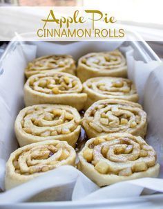 cinnamon rolls sitting in a pan on top of a table