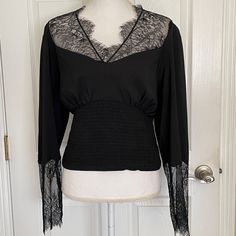 Women’s Long Sleeve Blouse V Neck Smocked Waist Lace In Neck And Sleeves Back Button New With Tags V-neck Lace Top Blouse For Work, Spring V-neck Lace Top For Night Out, Spring Long Sleeve V-neck Top For Night Out, Stretch Lace V-neck Top, Long Sleeve Blouse With Lace Trim For Night Out, Elegant Long Sleeve V-neck Top For Night Out, Casual V-neck Blouse For Evening, Elegant Stretch V-neck Top For Spring, Lace Top V-neck For Night Out