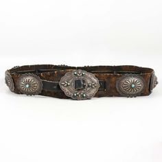 Antique Navajo (1930s) Sterling Silver Concho Belt on 2” Wide Original Leather. This concho belt features a beautiful sterling silver buckle with Hand Stamped Designs as well as 10 matching sterling silver conchos belts, all set with Natural American Turquoise.Buckle Dimensions: 3.25” x 2.5”Concho Dimensions: 2.625” x 2.5”Concho Belt Length: Holes Punched at 33” - 37”, maximum belt length of 39” Concho Belt, Belt Length, American Turquoise, Old Jewelry, Stamp Design, Hole Punch, Hand Stamped, Vintage Collection, Vintage Jewelry