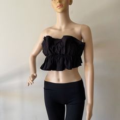 New Without Tags Black Ruffle Tied Back Crop Top Size S 72% Rayon 24% Nylon 4% Spandex Black Bandeau Tube Top With Ruffles, Black Cropped Ruffle Crop Top, Black Ruffled Crop Top, Black Ruffled Crop Top For Summer, Chic Cotton Tube Top For Night Out, Black Bandeau Top For Spring, Black Ruffled Crop Top For Night Out, Flirty Black Cropped Top, Flirty Black Crop Top