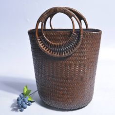 Our Larysa Bucket Bag is woven from straw and has a square shape with rounded handles. It is the perfect accessory for vacations or summer days in the city.Specs: Material: Straw Hollow Out Zipper closure Chic Woven Beach Bag With Round Handle, Trendy Straw Bag With Round Braided Handles, Trendy Straw Bag With Braided Round Handles, Trendy Straw Bag With Braided Handles, Chic Beach Shoulder Bag With Round Handle, Chic Shoulder Bag With Round Handle For Beach, Trendy Woven Straw Bag With Round Handle, Straw Shoulder Bag With Round Handle For Beach, Trendy Beach Bags With Round Handle