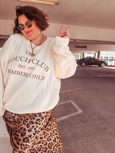 Join the exclusive Couch Club with our Old Money Vibes sweatshirt! Featuring "Couch Club" graphics and soft fleece lining, this cream-colored sweatshirt with brown embroidery is perfect for lounging in style. Touch it to believe it. Model: Kylie, wearing size 2X Model: Jordin, wearing size Large Cream Letter Print Sweatshirt For Loungewear, Beige Letter Print Sweatshirt For Loungewear, Brown Embroidery, Colorful Sweatshirt, Top Graphic Tees, Accessories Jacket, Equatorial Guinea, British Indian, British Indian Ocean Territory