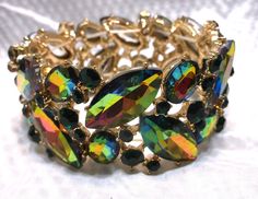 "Multi Color Crystal Marquis Stretch Statement Bracelet, Beautiful Bright and Shiny Measures approx 2 1/2 \" around and 1 1/2 \" High" Elegant Multicolor Stretch Bracelet For Party, Multicolor Jewel Bracelets For Party, Green Cuff Bracelet For Party, Multicolor Adjustable Cuff Bracelet For Formal Occasions, Costume Jewelry Round Bracelets For Party, Adjustable Multicolor Cuff Bracelet For Formal Occasions, Multicolor Costume Jewelry Bracelets With Jewels, Multicolor Jewel Costume Jewelry Bracelets, Round Costume Jewelry Bracelets For Party