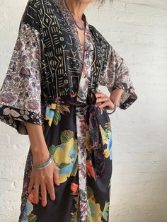 "This is super stylish kimono robe made patchwork of varieties silky materials  It is in free size with wrap tie closing, with smal splits on the side  easy fit all ladies, feels very comfortable and light  Can be used as an everyday robe or boho street style over all with jeans and t shirt  It is made one of a kind, patchwork from varieties of different floral silky materials  MEAESURE shoulder 17\" length 55\" MATERIAL *poliester, no lining CARE INSTRUCTIONS  * Wash in warm water * Hand wash r Multicolor Patchwork Kimono With Kimono Sleeves, Multicolor Kimono Sleeves Robe For Festival, Multicolor Wrap Kimono With Patchwork, Multicolor Patchwork Wrap Kimono, Multicolor Floral Print Wrap Robe, Multicolor Patchwork Robe With Kimono Sleeves, Stylish Kimono, Boho Street Style, Patchwork Kimono