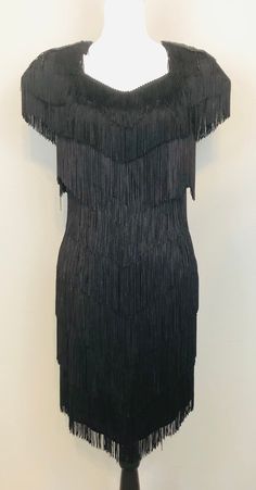 "Vintage Petite Black Fringe Cocktail Dress with Sequin and Beaded Epaulets and Keyhole Back / Gatsby Fringe Dress Measurements:    Bust: 36/38\" Waist: 30/32\" Hips: 36/38\" Length: 34\" (at the shortest point) Tag Size: 12 Petite Material: Polyester  Dress is in very good condition." Black Gatsby Style Gala Dresses, Black Gatsby Gala Dress, Elegant Fitted Flapper Dress For Night Out, Black Fringe Flapper Dress For Evening, Black Flapper Dress With Fringe For Evening, Embellished Gatsby Style Formal Dress, Gatsby Style Embellished Formal Dress, Formal Gatsby Embellished Dress, Evening Black Flapper Dress With Fringe