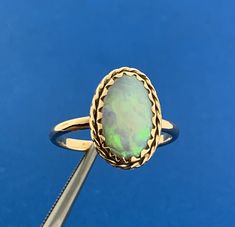 * Vintage 14K Yellow Gold Oval Opal Cabochon Solitaire October Anniversary Ring * Ring size: 8.0 * Top of ring measures: 3/4" x 1/2" * Height: 1/8" * Band width: 2.06 mm or approximately 1/16" * Oval Opal Cabochon measures approximately 14.0 mm x 8.5 mm * Ring weight: 3.1 tgw * Marked: MAKERS MARK * 14K * Condition: As pictured. * G2967 5% Restocking Fee    Exported By ExportYourStore :) Anniversary Ring, Ring Ring, Womens Jewelry Rings, Anniversary Rings, Makers Mark, Favorite Jewelry, Vintage Jewelry, Jewelry Rings, Opal