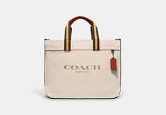 Canvas and smooth leather Inside multifunction pocket Zip-top closure fabric lining Handles with 6 drop Detachable strap with 21 3/4 drop for shoulder or crossbody wear 15 (L) x 13 1/2 (H) x 7 (W) Style No. CJ486 Sustainable Bag, Men's Totes, Coach New York, Coach Outlet, Canvas Tote Bag, Belt Bag, Smooth Leather, Canvas Tote, Gifts For Mom