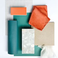 an assortment of different colored materials on a white surface