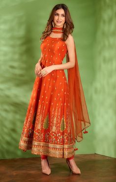 Editor's Note Featuring Tangerine Rust Anarkali Set In Dupion Silk Base With Multi-colored Floral Thread Embroidery Which Is Highlighted With Various Techniques Like Zardosi, Dabka, Sequins And... Bridal Suit Indian, Rust Indian Outfit, Anarkali Dress From Saree Ideas, Suits For Weddings Women, Anarkali Suits Casual, New Anarkali Design, Rust Anarkali, Anarkali Design, Floral Thread Embroidery