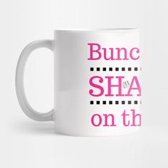 a white coffee mug with pink lettering that says bunc sha on the inside and bottom