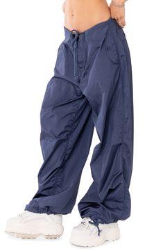 Designed with an oversized fit for a borrowed look, these billowy cargo pants pack a stylish punch. 100% nylon Machine wash, dry flat Imported Functional Wide Leg Parachute Pants For Outdoor, Functional Wide-leg Parachute Pants For Outdoor, Nylon Wide Leg Bottoms For Outdoor Activities, Nylon Wide Leg Cargo Parachute Pants, Nylon Wide Leg Parachute Pants With Cargo Pockets, Functional Wide Leg Nylon Parachute Pants, Wide Leg Nylon Parachute Pants With Cargo Pockets, Blue Baggy Cargo Parachute Pants, Outdoor Nylon Wide Leg Pants