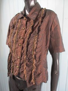 Very pretty chocolate brown ruffled blouse with short sleeves and a lace front. It has a collar and small silver buttons down the front. Dimensions: Bust: 40 Inches. Length: 21 Inches. Made in France Brown Blouse, Ruffled Blouse, Brown Shirt, Vintage Blouse, Summer Blouses, Silver Buttons, Lovely Dresses, Blouse Vintage, Cut And Style