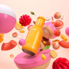 an orange bottle sitting on top of a wooden table surrounded by balloons and other objects