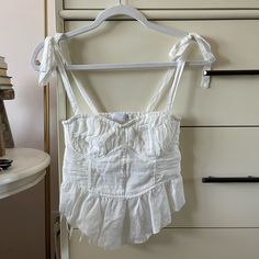 This Is So Cute, Never Worn Once Due To It Being Too Small On Me. Labeled S But Fits More Like Xs/Xxs To Be Honest. Now Sold Out In This Size. Summer White Crop Top With Tie Straps, White Crop Top With Tie Straps For Summer, White Vacation Tops With Tie Straps, White Tops With Tie Straps For Vacation, White Tie Strap Tops For Beach, Linen Corset, Silver Sequin Top, Colorful Vest, Strappy Bralette