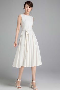 "This Off white linen dress features a fit and flare silhouette , pleated neckline . A must have lady midi dress, wearing this vintage inspired dress is a fashionable chance worth taking. DETAILS * Soft Linen, Medium weight Linen * 50% linen , 50% cotton * Cotton lining on upper part * Seam pockets * Boat neckline * Back zip closure * Sleeveless dress * Fit and flare dress * Below Knee Length * Summer, Spring * Wash by hand or machine with cold water, Ironing after dry * More color Choice and Mo Womens Long Dresses, White Linen Dresses, Linen Midi Dress, Vintage Inspired Dresses, House Dress, Inspired Dress, Linen Dress, Womens Midi Dresses, Fit And Flare Dress