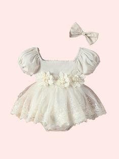 Dress your little princess in enchanting style with our Baby Girl's Bubble-Sleeve Mesh Romper With Flower Applique Skirt And Headband! This delightful ensemble combines whimsy and elegance, featuring a mesh romper with charming bubble sleeves and a flower applique skirt for added flair. Complete with a coordinating hea Summer Princess Dress With Lace Trim For Dress-up, Summer Princess Dress With Lace Trim, Fitted Lace Princess Dress For Summer, Summer Lace Princess Dress With Lace Trim, Cream Short Sleeve Bubble Romper For Summer, Fitted Princess Dress For Summer Baptism, Elegant Spring Bubble Romper With Ruffles, Fitted Lace Tutu Dress With Floral Applique, Summer Lace Princess Dress For Dress-up