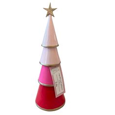 a pink and red christmas tree with a star on top