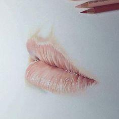 a pencil drawing of a pink lip on paper