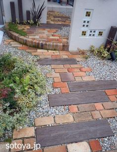 a brick pathway leading to a house