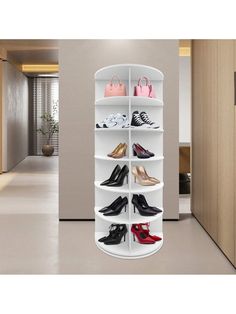 an image of a white shoe rack in the middle of a room with shoes on it