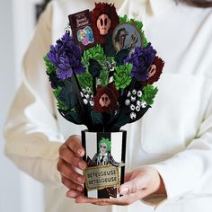 a person holding a bouquet of flowers in their hands