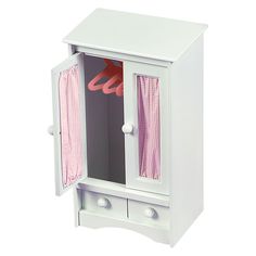 a white wooden cabinet with pink curtains