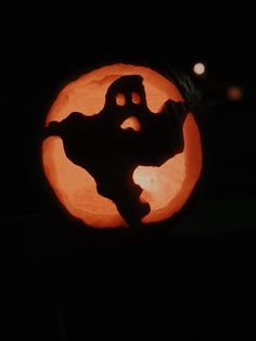 a carved pumpkin with the shape of a cat on it