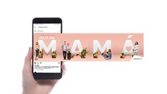 a hand holding an iphone with the word mamma on it and two people standing in front of them