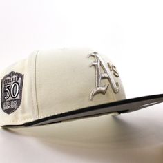 Oakland Athletics 50th Anniversary New Era 59Fifty Fitted Hat in Chrome White, Black with Gray Under Brim. 🐘 - https://www.ecapcity.com/products/oakland-athletics-50th-anniversary-new-era-59fifty-fitted-hat-chrome-white-black-gray-under-brim - #ECAPCITY #Neweracap #Athletics #BATTLEOFTHEBAY Chrome White, Hat Stores, Pink Bottom, New Era Cap, Icy Blue, New Era 59fifty, Oakland Athletics, Fitted Caps, Fitted Hat