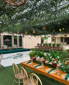 an outdoor event with tables and chairs set up for a formal dinner or function in the garden