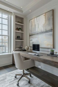 a desk with a computer on top of it next to a window in a room