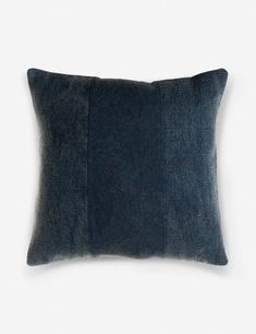 a dark blue pillow on a white background with the same color as it appears in this image