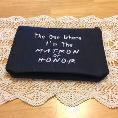 a black purse with the words, the one where i'm the matron of honor written on it