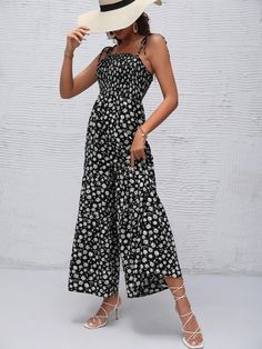 Stand apart from the crowd and show your unique vibe with this Floral Print Ruffle Cami Jumpsuit. This jumpsuit adds comfort, and style along with being versatile enough for every occasion. The frill, knot, and ruffle hem details add a touch of playfulness, while the shirred design ensures a flattering and comfortable fit. Specifications: Color: Black and White Style: Boho Pattern Type: Floral, All Over Print Type: Cami Details: Frill, Knot, Ruffle Hem, Shirred Length: Long Fit Type: Regular Fit Neckline: Spaghetti Strap Sleeve Length: Sleeveless Waist Line: High Waist Fabric: Non-Stretch Material: Woven Fabric Composition: 95% Polyester, 5% Elastane Care Instructions: Machine wash or professional dry clean Body: Unlined Sheer: No Product Measurements(cm): Size Bust Hip Size Inseam Length Spring Summer Strapless Jumpsuit With Floral Print, Spring Strapless Jumpsuit With Floral Print For Summer, Spring Strapless Jumpsuit With Floral Print, Spring Floral Print Strapless Sleeveless Jumpsuit, Summer Ruffled One-piece Jumpsuits And Rompers, Summer Ruffle Jumpsuits And Rompers, Summer Ruffles One-piece Jumpsuits And Rompers, Summer One-piece Jumpsuits And Rompers With Ruffles, Chic Floral Print Strapless Jumpsuit For Summer