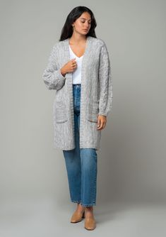 A cozy chunky knit cardigan with braided cable knit detail. FINAL SALE Chunky knit cardigan Relaxed fit Long sleeve with braided cable knit accent Mid-length Open front Side pockets Fall cardigan Your fall and winter wardrobe isn't complete without this chunky knit cardigan. With its cozy long sleeves and braided cable knit accents, it's the perfect blend of comfort and style. The open front and side pockets make it as practical as it is chic. Whether you’re layering over denim or draping it ove Winter Cable Knit Sweater Coat, Oversized Gray Cable Knit Cardigan, Oversized Gray Cable Knit Outerwear, Cable Knit Cardigan For Fall And Cold Weather, Gray Cable Knit Sweater Coat For Fall, Cozy Cable Knit Winter Cardigan, Cable Knit Sweater Coat For Cold Weather, Cozy Cable Knit Sweater Coat For Layering, Oversized Cable Knit Cardigan For Cold Weather