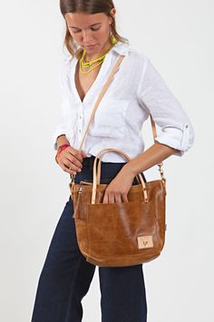 The Meanwhile Small Tote will be your new favorite sidekick whether you're running-errands, doing carpool duty or out on a day date. Work Bag Essentials, Leather Strap Bag, Horse Hair Tassels, Lynchburg Virginia, Waxed Canvas Bag, Limited Edition Bag, Brown Leather Totes, Key Clip, Dark Denim Jeans