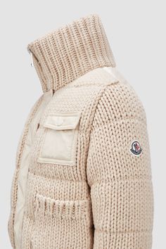 Designed to protect little ones from the elements, this heavy knit cardigan is crafted from plush wool. The zip-up design is enhanced with a down-filled back, allowing the style to double as outerwear in milder weather. Winter White Chunky Knit Outerwear For Cold Weather, Chunky Knit Wool Outerwear For Cold Weather, White Knitted Wool Outerwear, White Wool Knitted Outerwear, White Wool Knit Outerwear, White Chunky Knit Wool Outerwear, Winter Merino Wool Knit Outerwear, Cozy White Merino Wool Outerwear, Cozy Cream Merino Wool Outerwear