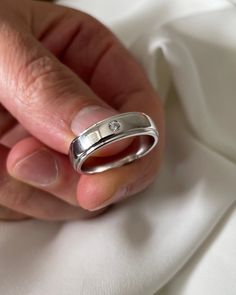 a person holding a ring in their hand