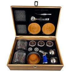 an open wooden box filled with assorted items