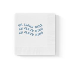 a napkin with the words on cloud nine on it in blue ink, against a white background