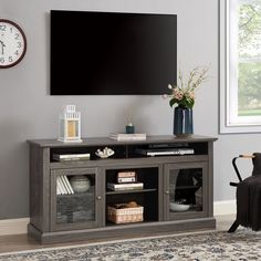 a living room with a large flat screen tv on the wall