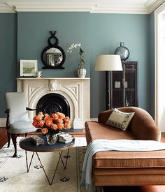 a living room with blue walls and furniture